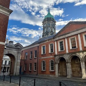 Street picture of Dublin. Old buildings with a small tower on the back.